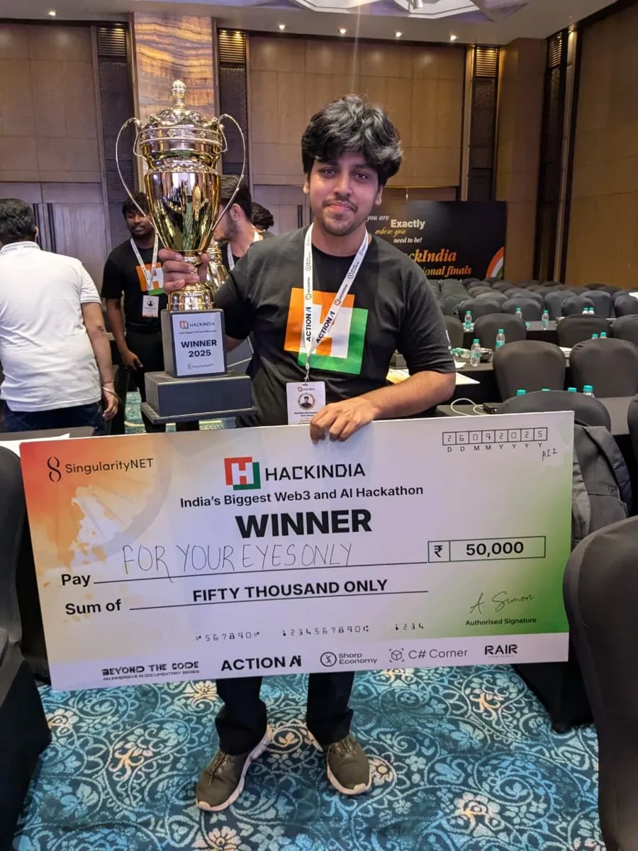 Sarthak holding the HackIndia 2025 winner trophy and a ₹50,000 cheque